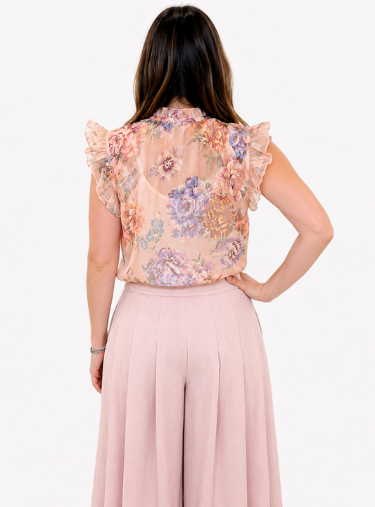 Blusa fiorata con volan