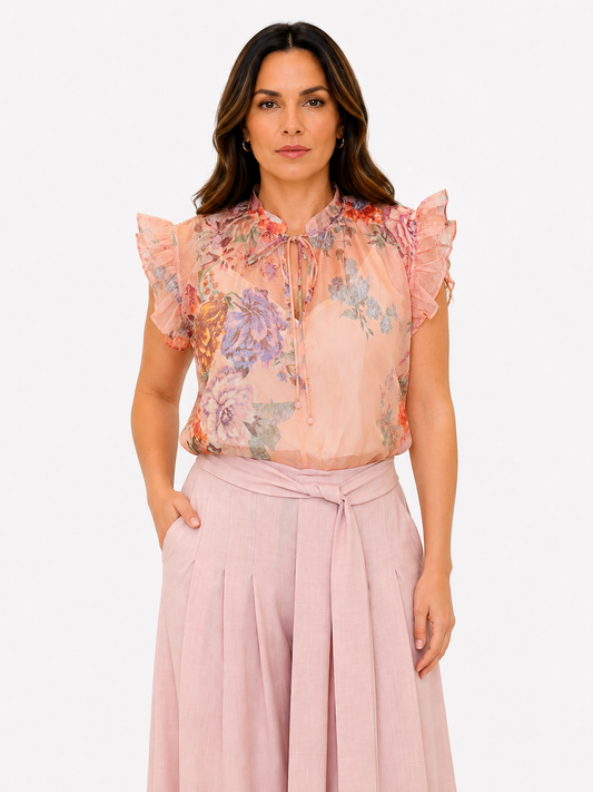 Blusa fiorata con volan